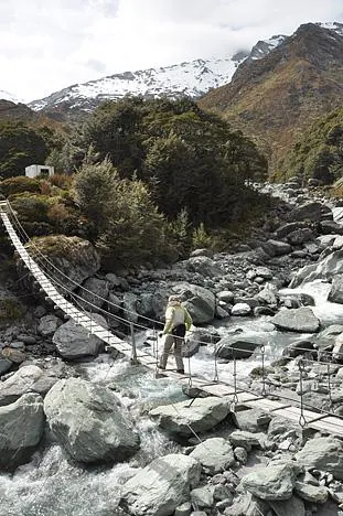 Gill terrified crossing the bridge after Dart Hut. On our return in foul weather and shaking limbs, it was her worst ever bridge experience