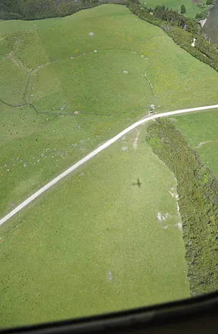 Our little plane silhouetted on the fields below