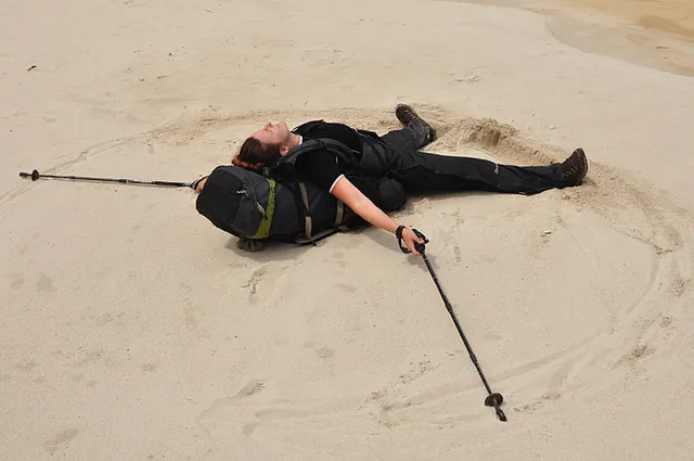 We reach Surprise Bay and Gill feels the need for some sand angels