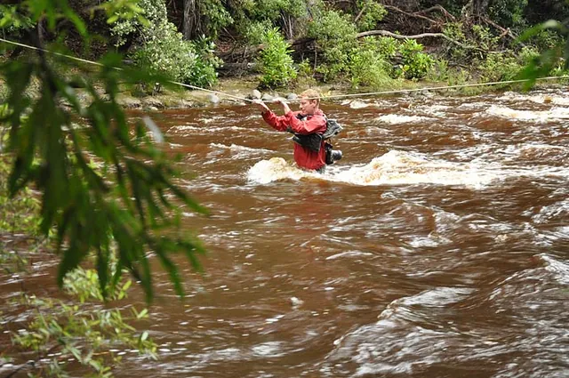 We reach the Louisa River and look on in disbelief as Ed is half way across already in waist deep water!