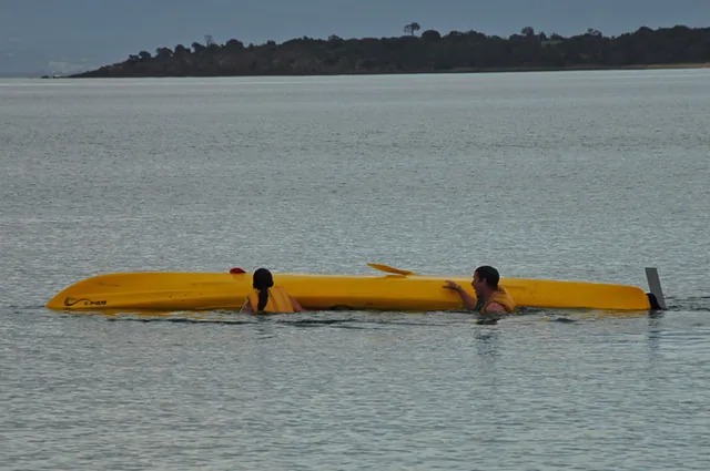 After 2 x girly screams are heard, they emerge and get back into the kayak with full marks awarded