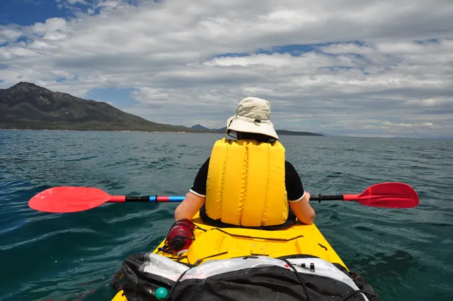 Kayaking straight across the deeper section of the bay to save time