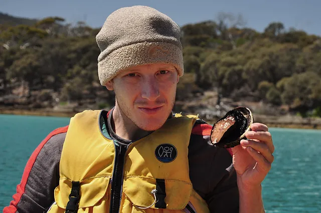 Ed pulling up a black lipped abalone. We found out later that these were worth a sizeable sum at the fish market