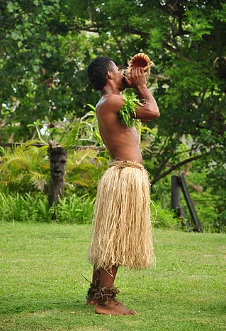 The horn blow to mark the start of the firewalking show