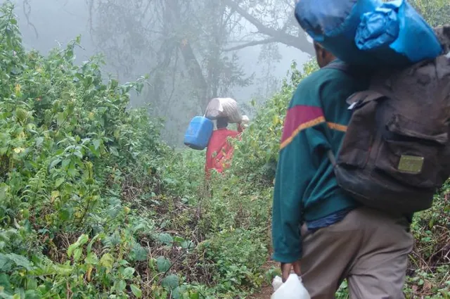 Our porters (18 of them!) steam past us after about an hour