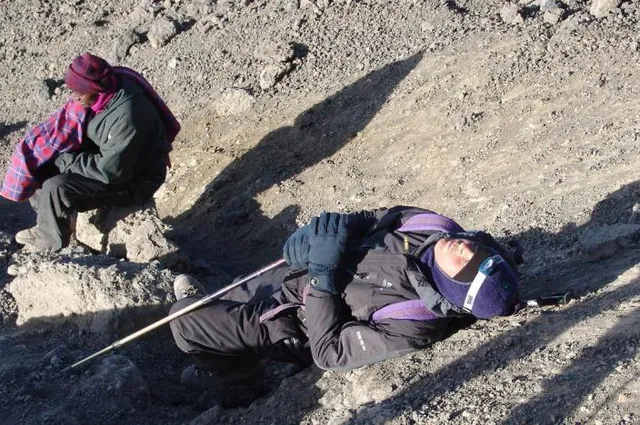 The final steps to the crater edge are slow and painful