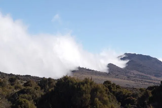 The clouds roll in and hit the ridge line