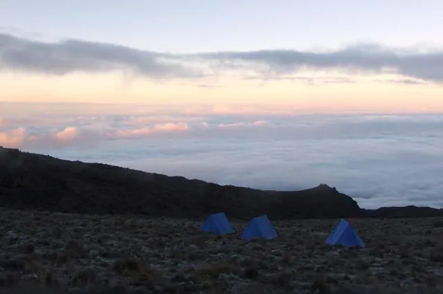 Three lonely tents sitting 4000m up the side of Kilimanjaro