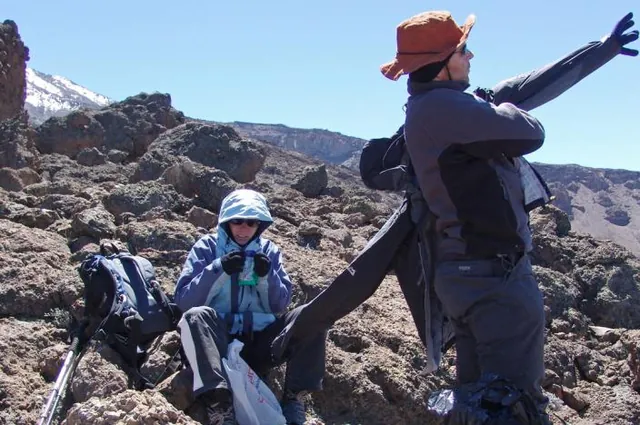 Alex trying to put on an incredibly stiff jacket