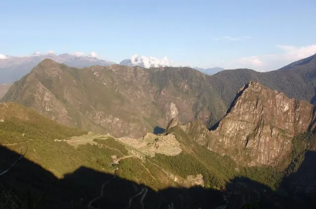 And here high up from the Sun Gate, we get our first faraway glimpse of the ancient Inca city of Machu Picchu. Check out our Machu Picchu page for pics within the city