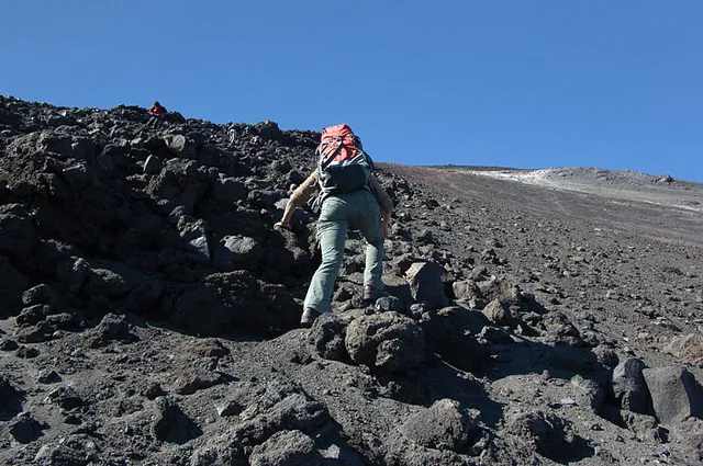 Best to go up the firmer lava flow rocks on the left - should have left the packs at the bottom!