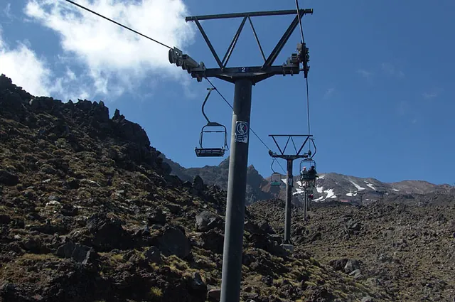The two seat chair lift is a bit basic on the way up - joining with a better 4 seater for the second leg