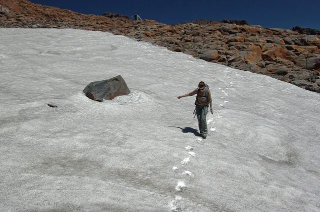 We venture into the snow following a slightly different route down (see the video tab for our glissading efforts)