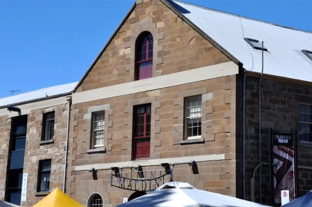 There are many of these distinctive old sandstone warehouse buildings in Salamanca Place