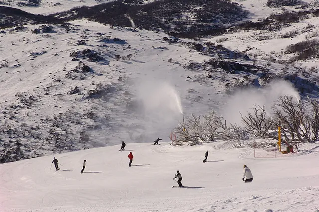 Snow cannons keep some of the pistes topped up by day