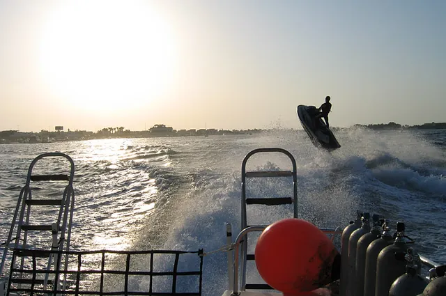 Heading back to port, local Saudis use our wake to get air on their jetbikes