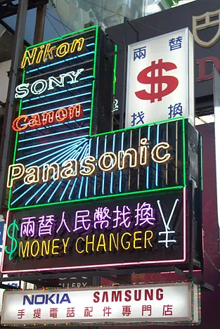 Shops and neon signs are everywhere in the side streets