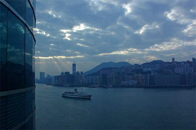 A gloomy early morning in Kowloon with a cruise ship coming into Victoria Harbour