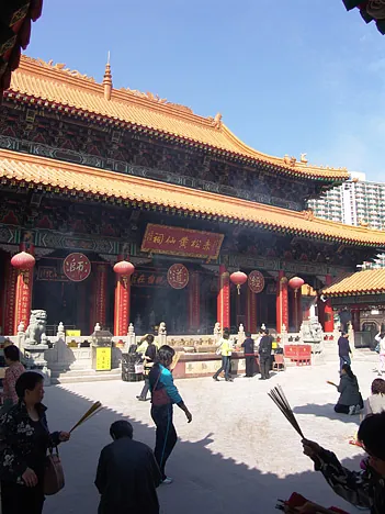 Visitors burn incense sticks, pray before the main altar and make a wish