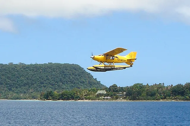 The iconic yellow Vanuatu Seaplane doing a flyby as we return from scuba diving