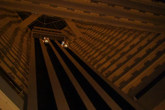 Looking up at spaceship lifts in the hotel from the bar