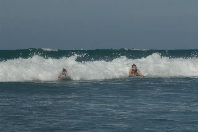The girls trying out synchronised surfing