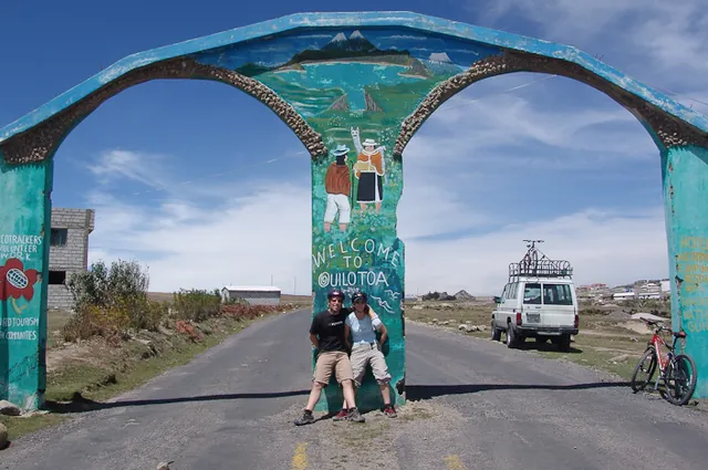 After a hard slog biking uphill we reach the crater welcome archway