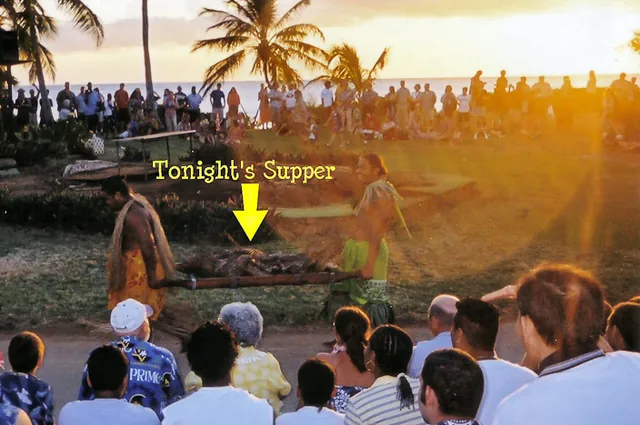 Spit-roasted Kalua pig is excavated from the underground cooking pit
