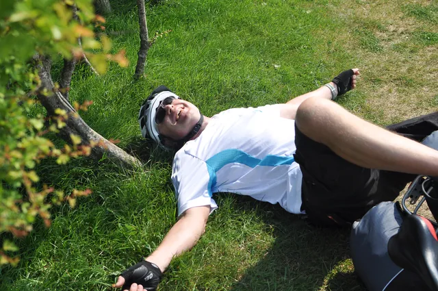 Neil taking a tumble with the weight of the panniers pulling him over on a stop