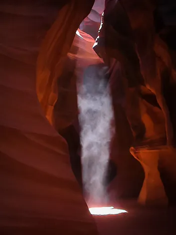 The amazing shafts of light with fine sand floating in the air