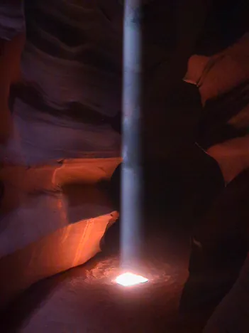 A thin beam of light squeezes through like a laser. 10 out of 10 ... stunning!