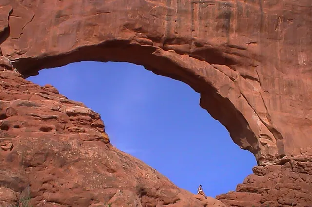 Gill looking tiny beneath the North Window arch