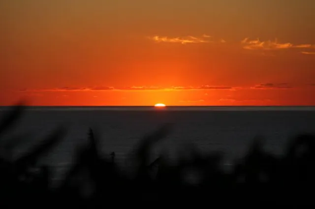 Nothing beats a cold glass of white wine and a sunset like this