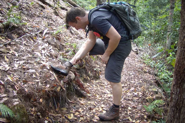 The careful art of flicking leeches off your boots with a twig