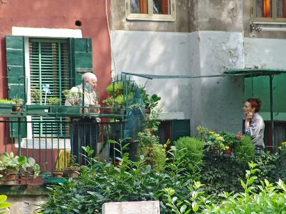A neighbourly chat across the balcony garden wall
