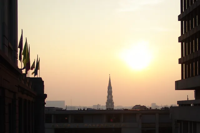 The city hall turret stands prominent against the Brussels sky line