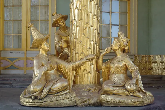 Gilded Chinese figures sit in the entranceways