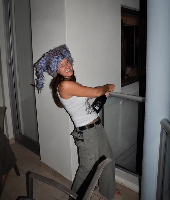 Launching a champagne cork off the 5th floor balcony onto the street below [*slightly irresponsible*]