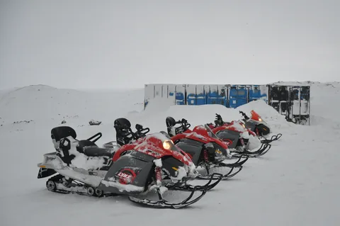 Snowmobiles running, and partly iced up before we even start!