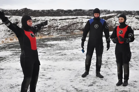Suitably kit up in dry suits in freezing conditions