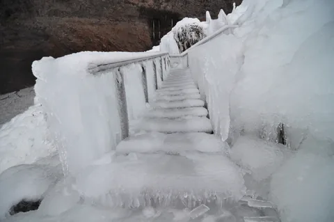 Frozen stairs from the waterfall spray