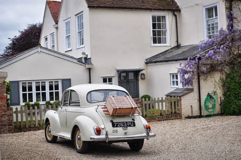 The Morris Minor probably doesn't run, but it sure looks pretty outside this house in South Stoke