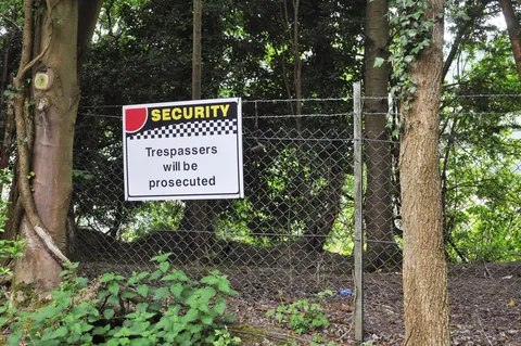 Intense security signs and guards in vehicles protecting the quarry near Chinnor