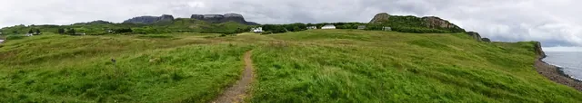 Panorama shot looking back at the Flodigarry Hotel and the Quairaing in the distance