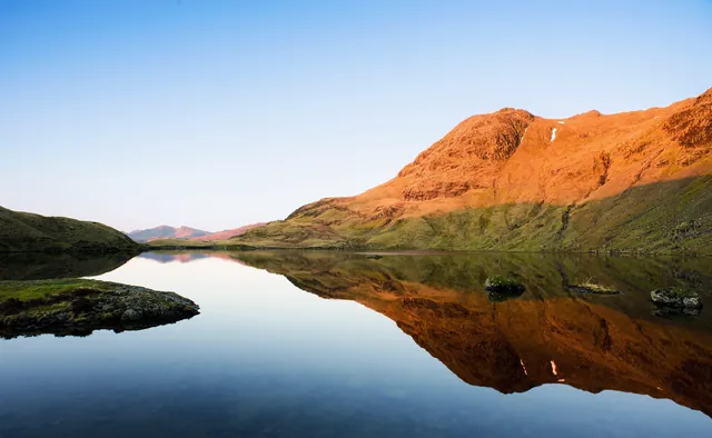 Mirror-like tarn view to look at whilst making the coffee