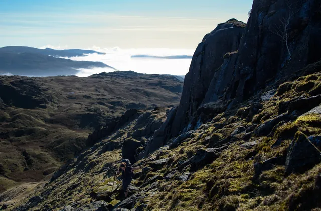 Cloud inversion in the background and steep climb