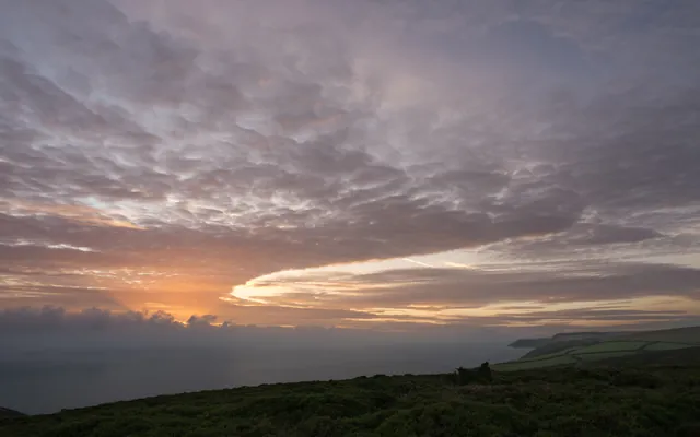Sunrise from Butter Hill near Countisbury. Not the best colours in the sky, but the cloud formation was special