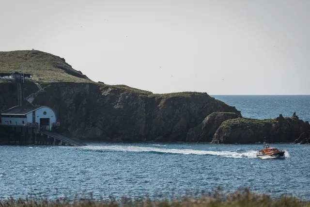 The Padstow lifeboat launching at Polventon Bay