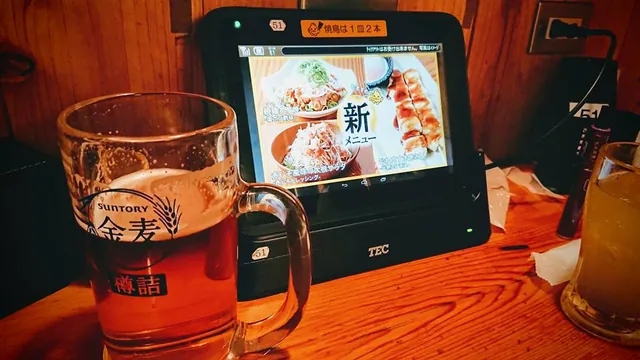 Big beer accompaning the lcd touchscreen waitress system