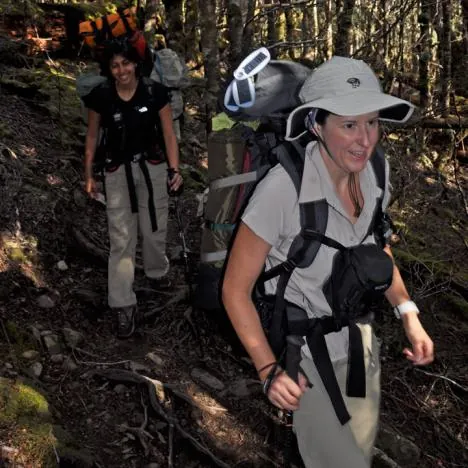 Gadget girl strapped up with solar panels, video camera and walkie talkie